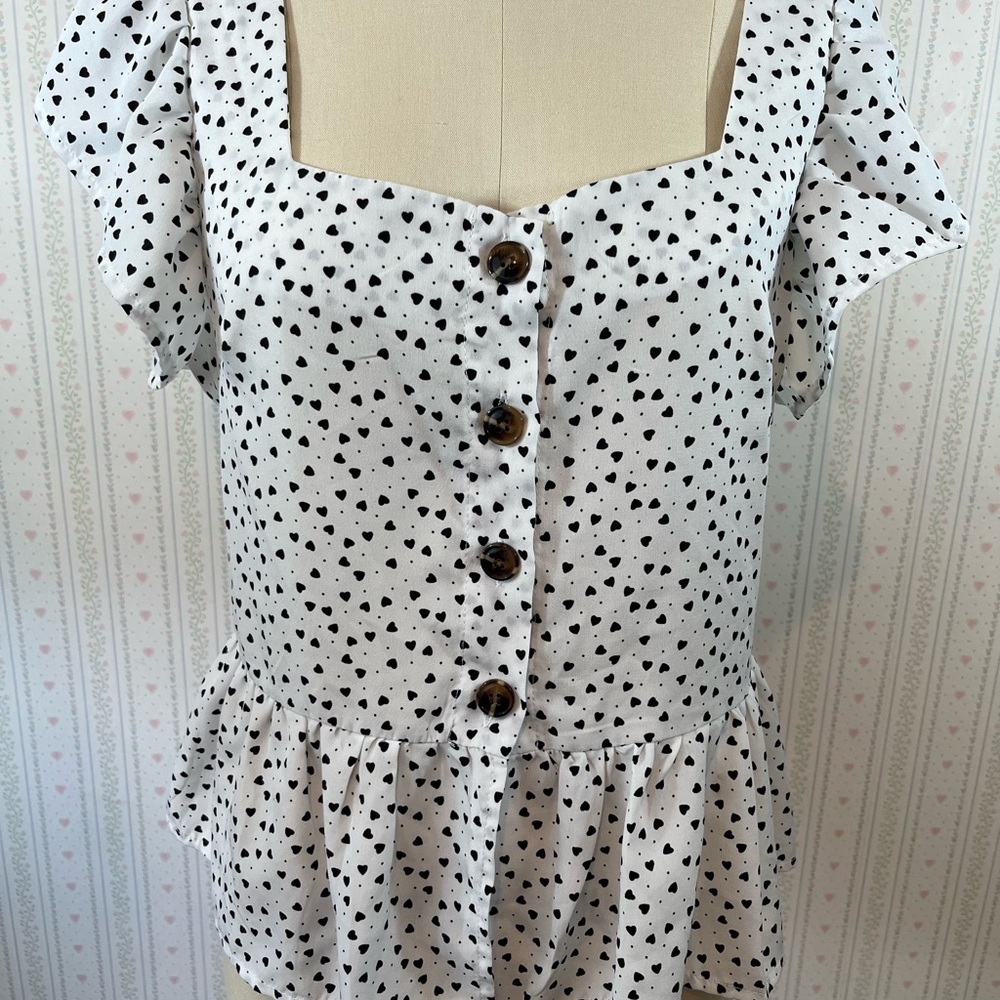 Black heart button down ruffle blouse.